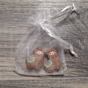 Brown alpaca needle stoppers in organza bag